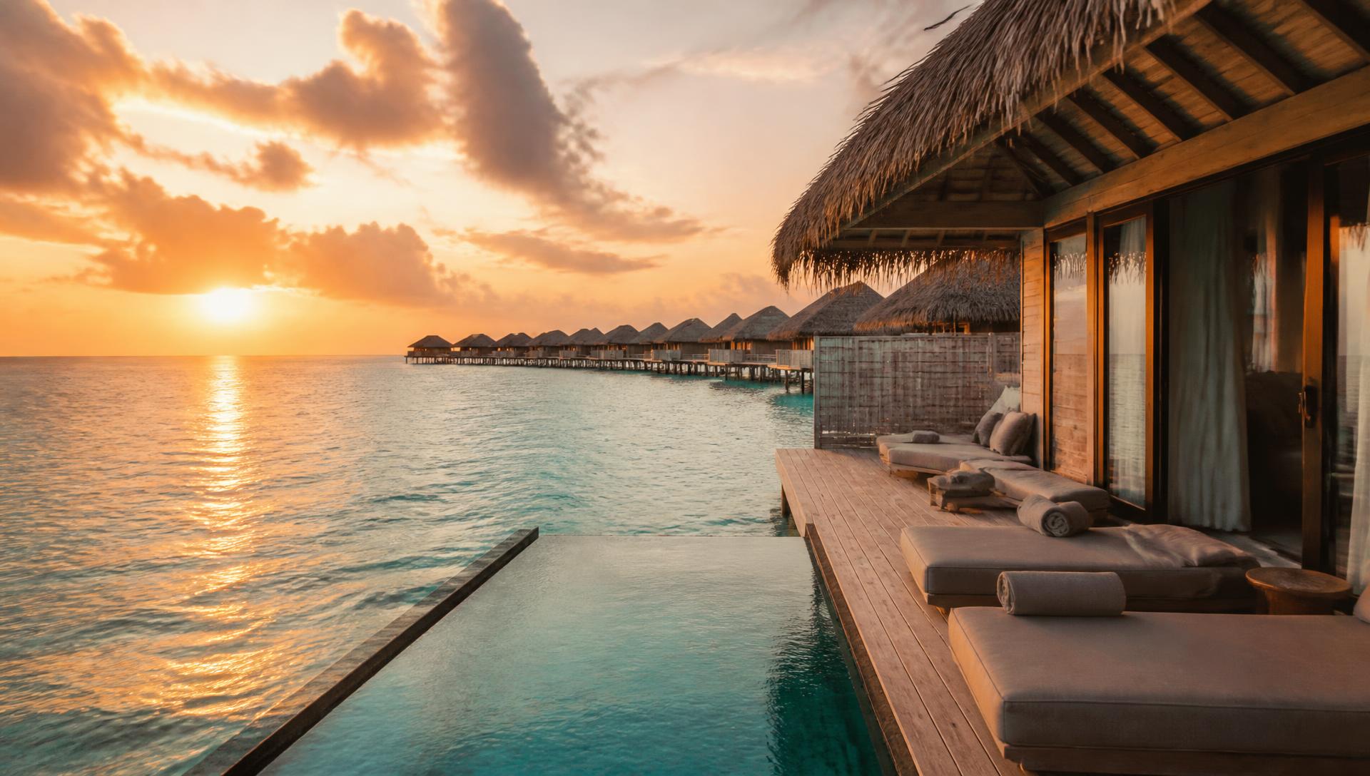 Overwater villas at sunset in the Maldives